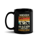 Never Underestimate and Old Man Who Loves Paragliding Black Glossy Mug