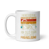 Never Underestimate and Old Man Who Loves Paragliding White glossy mug