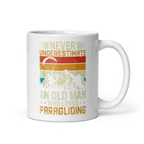 Never Underestimate and Old Man Who Loves Paragliding White glossy mug