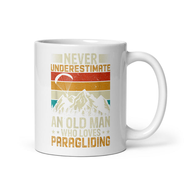 Never Underestimate and Old Man Who Loves Paragliding White glossy mug