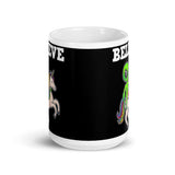 Believe (Alien on Unicorn) White glossy mug