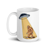 Abducting Bigfoot White glossy mug