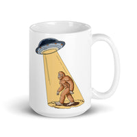 Abducting Bigfoot White glossy mug